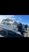 6.5 meter Bertram boat on trailer