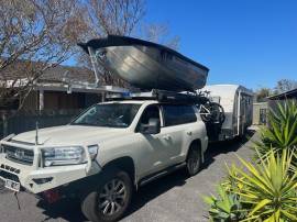 Landcruiser with small boat and caravan